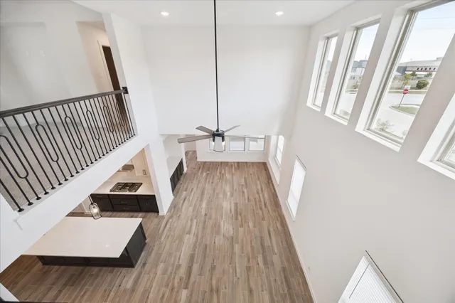 a view of balcony with wooden floor