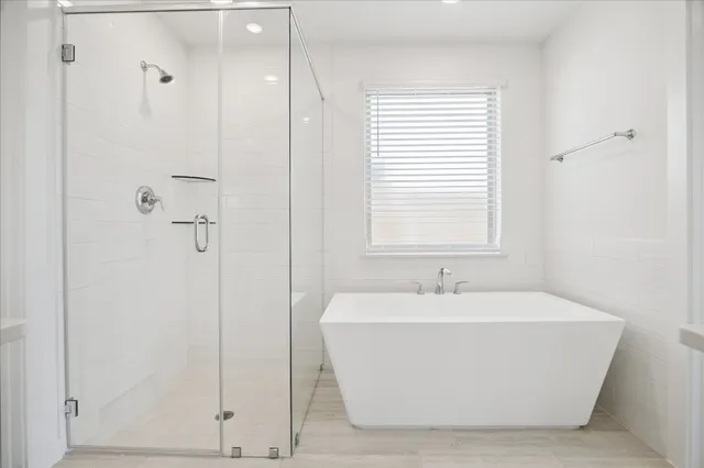 a white bath tub sitting in a bathroom