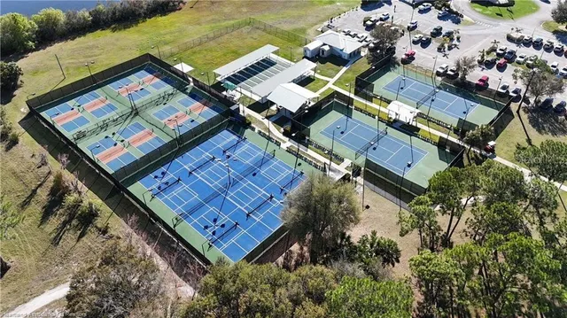 an aerial view of a residential apartment building with a yard