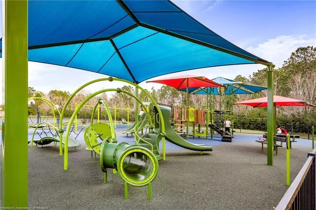 an outdoor space with furniture and umbrella