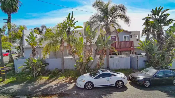 a car parked in front of a house