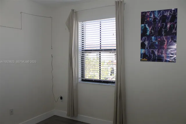 a small space with a window and a bathroom