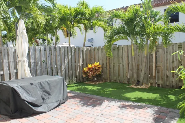 a view of a backyard with a garden