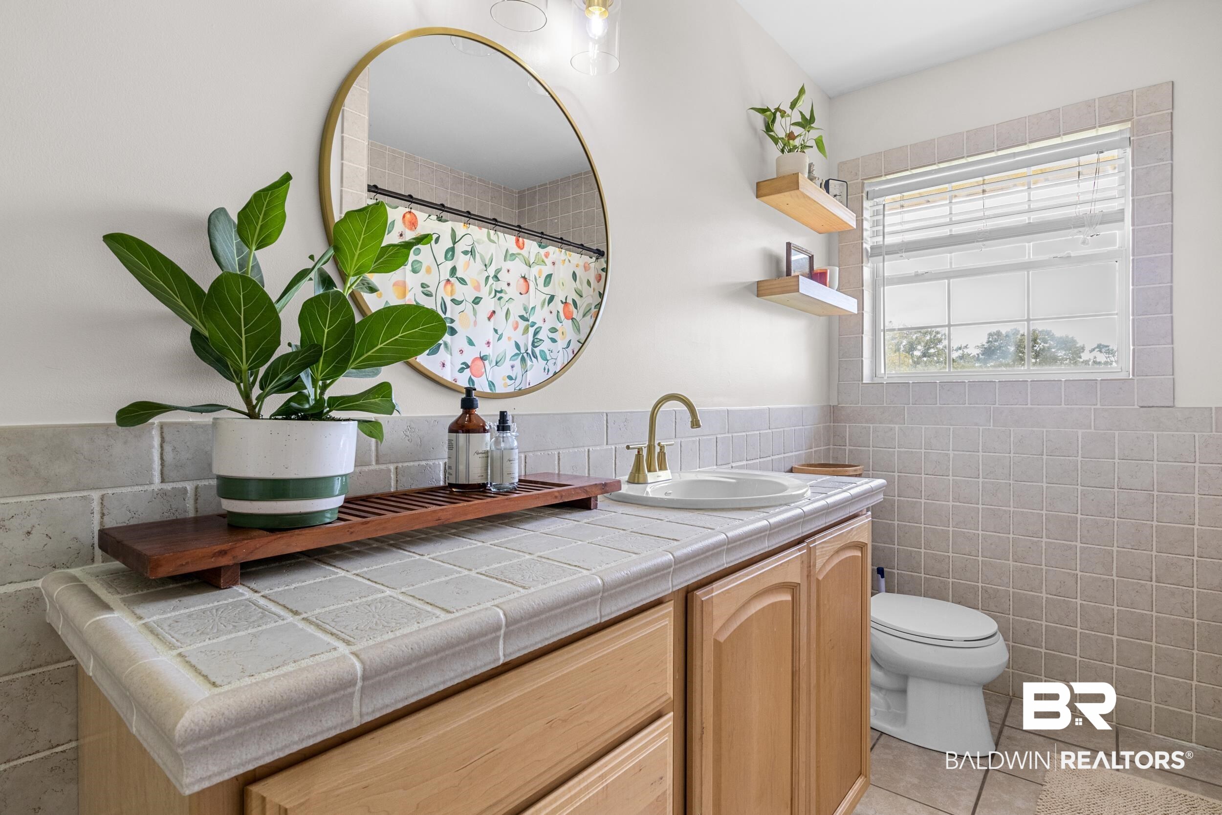 17689 Brewer Road Foley, AL 36535 - Photo 34 of 54 Bathroom with vanity, tile walls, toilet, and tile patterned floors