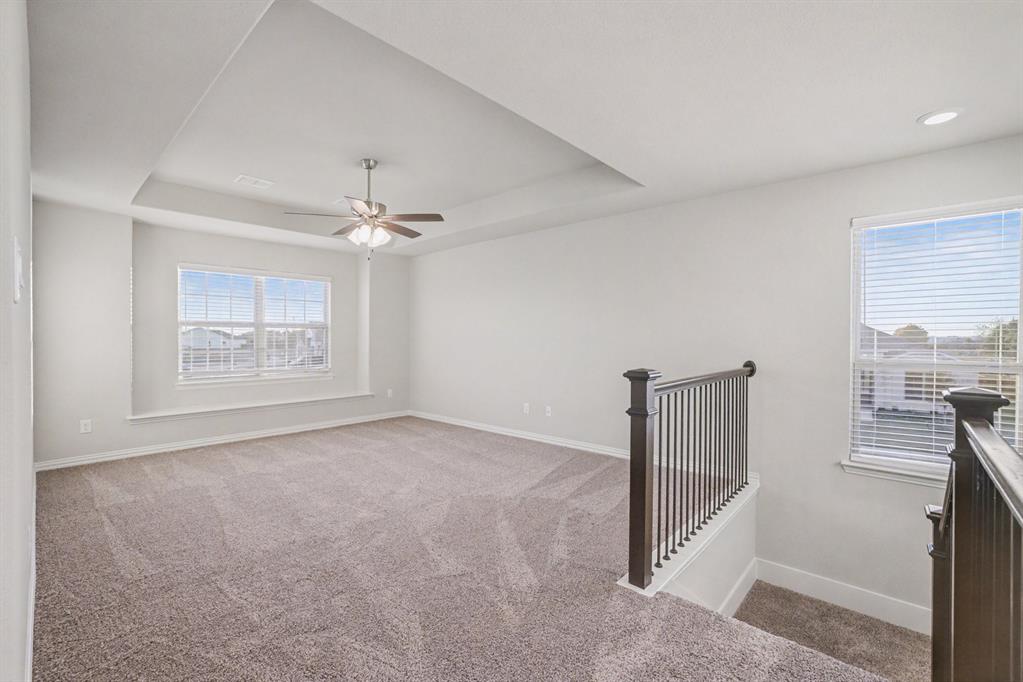 2404 Peebles Lane Denton, TX 76207 - Photo 22 of 30 a view of an empty room with a window