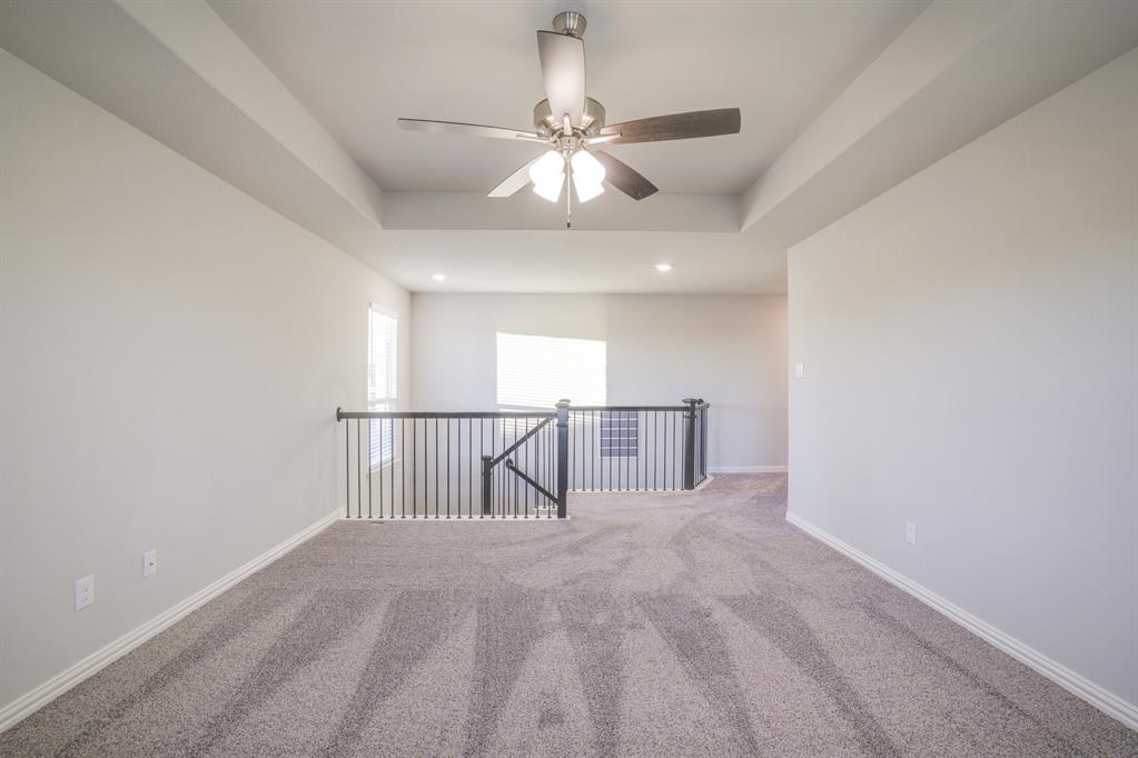 2404 Peebles Lane Denton, TX 76207 - Photo 23 of 30 a view of a livingroom with a ceiling fan and window