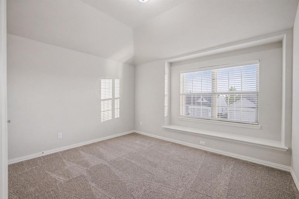 2404 Peebles Lane Denton, TX 76207 - Photo 25 of 30 a view of an empty room with a window