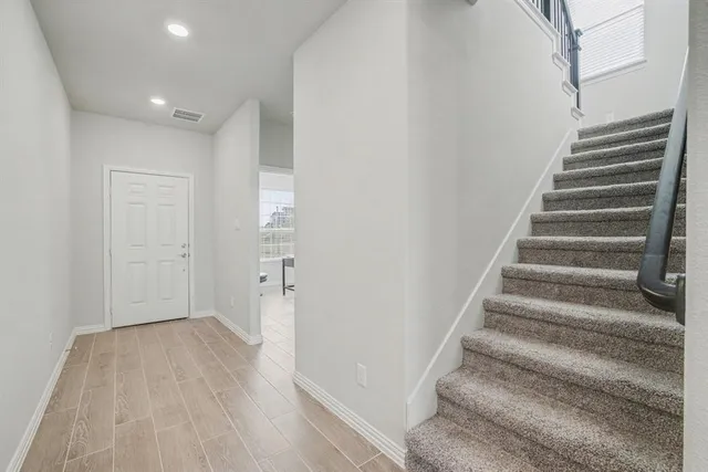 a view of entryway with wooden floor