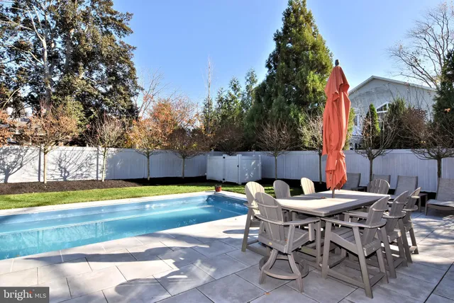 a view of a chairs and table in the patio