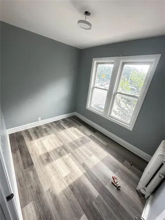a room with gym equipment and a window