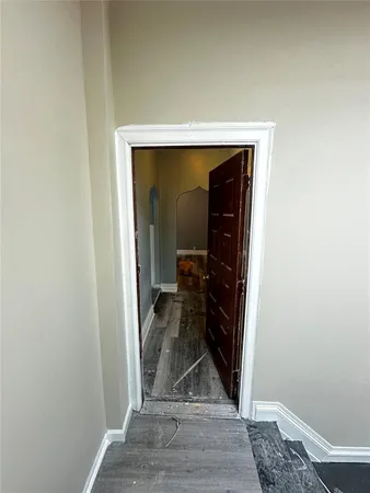 a view of a hallway with a living room