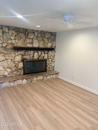 a view of wooden floor and a fireplace in a room