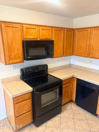 a kitchen with a stove microwave and sink