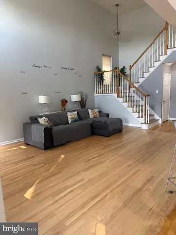 a bed sitting in a room next to a window