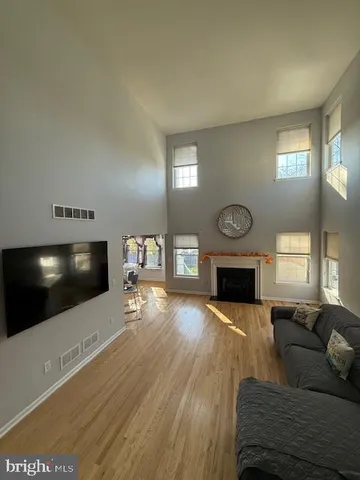 a bedroom with a bed and a flat tv screen