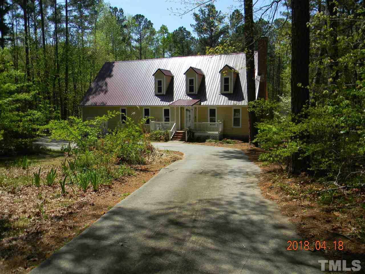 3309 Manor Ridge Drive Raleigh, NC 27603 - Photo 2 of 24 a front view of house with yard and trees in the background