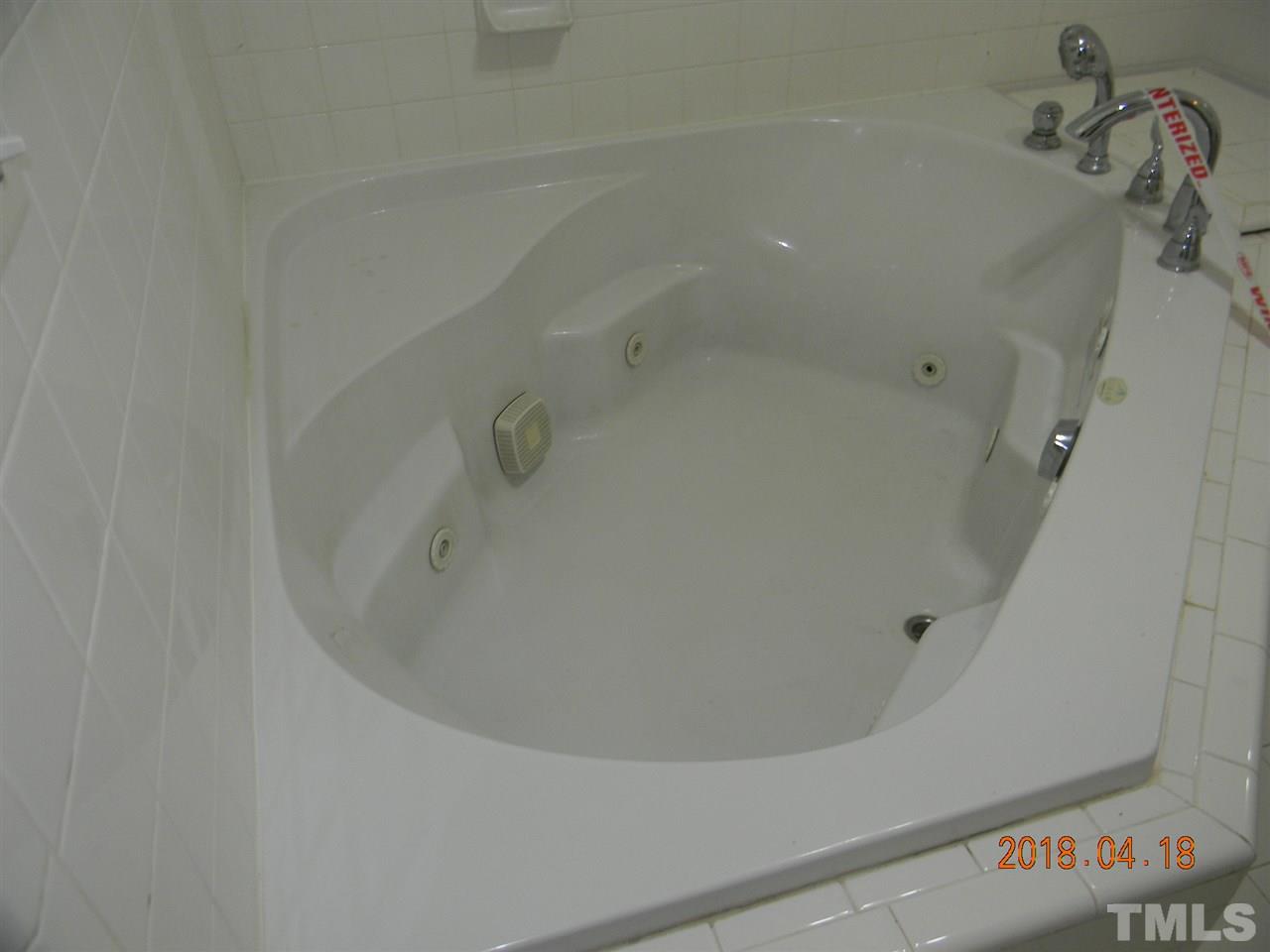 3309 Manor Ridge Drive Raleigh, NC 27603 - Photo 14 of 24 a bathroom with a bathtub