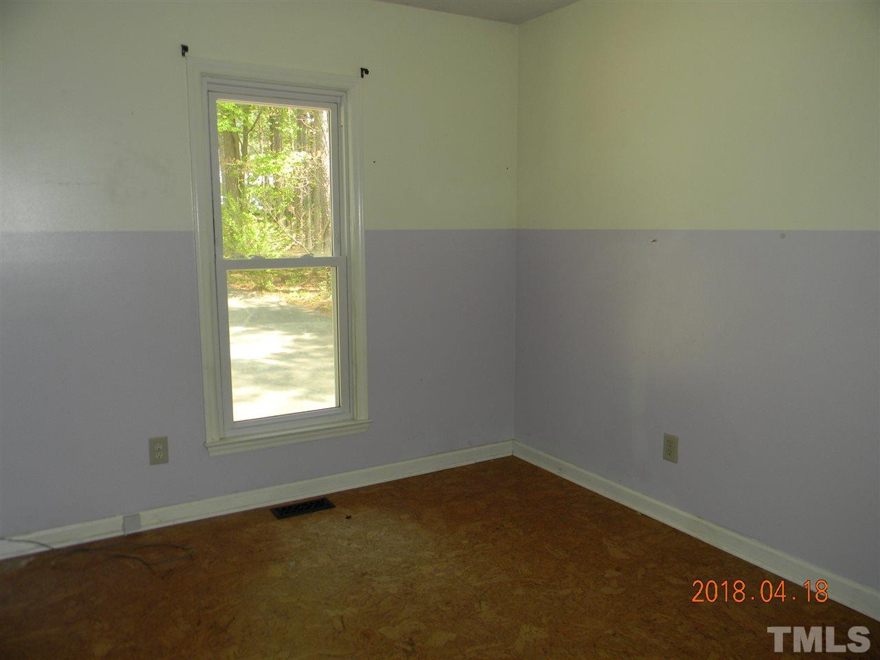 3309 Manor Ridge Drive Raleigh, NC 27603 - Photo 15 of 24 an empty room with a window
