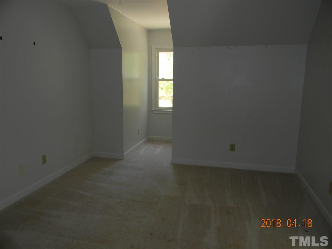 3309 Manor Ridge Drive Raleigh, NC 27603 - Photo 20 of 24 an empty room with a window