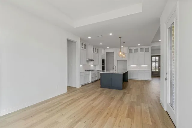 a view of kitchen with wooden floor