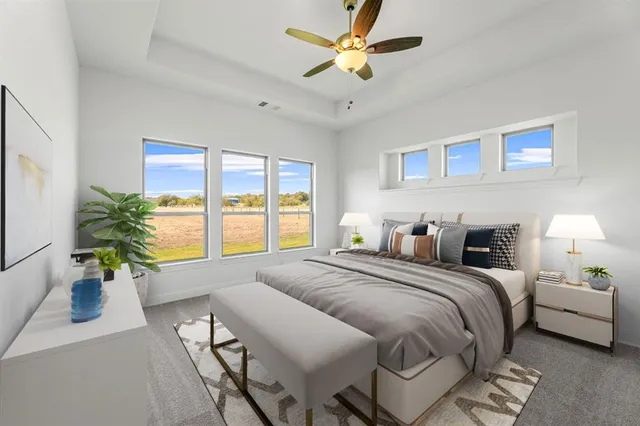 a bedroom with a balcony a bed and a chandelier