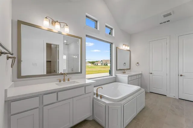 a bathroom with a sink a washer and dryer