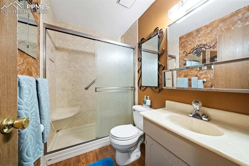 9180 McClelland Road Calhan, CO 80808 - Photo 21 of 31 a bathroom with a sink toilet and shower