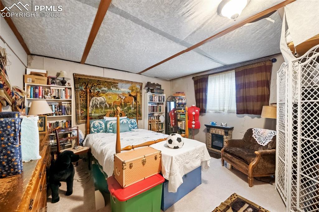 9180 McClelland Road Calhan, CO 80808 - Photo 27 of 31 a bed room with a bed and a window