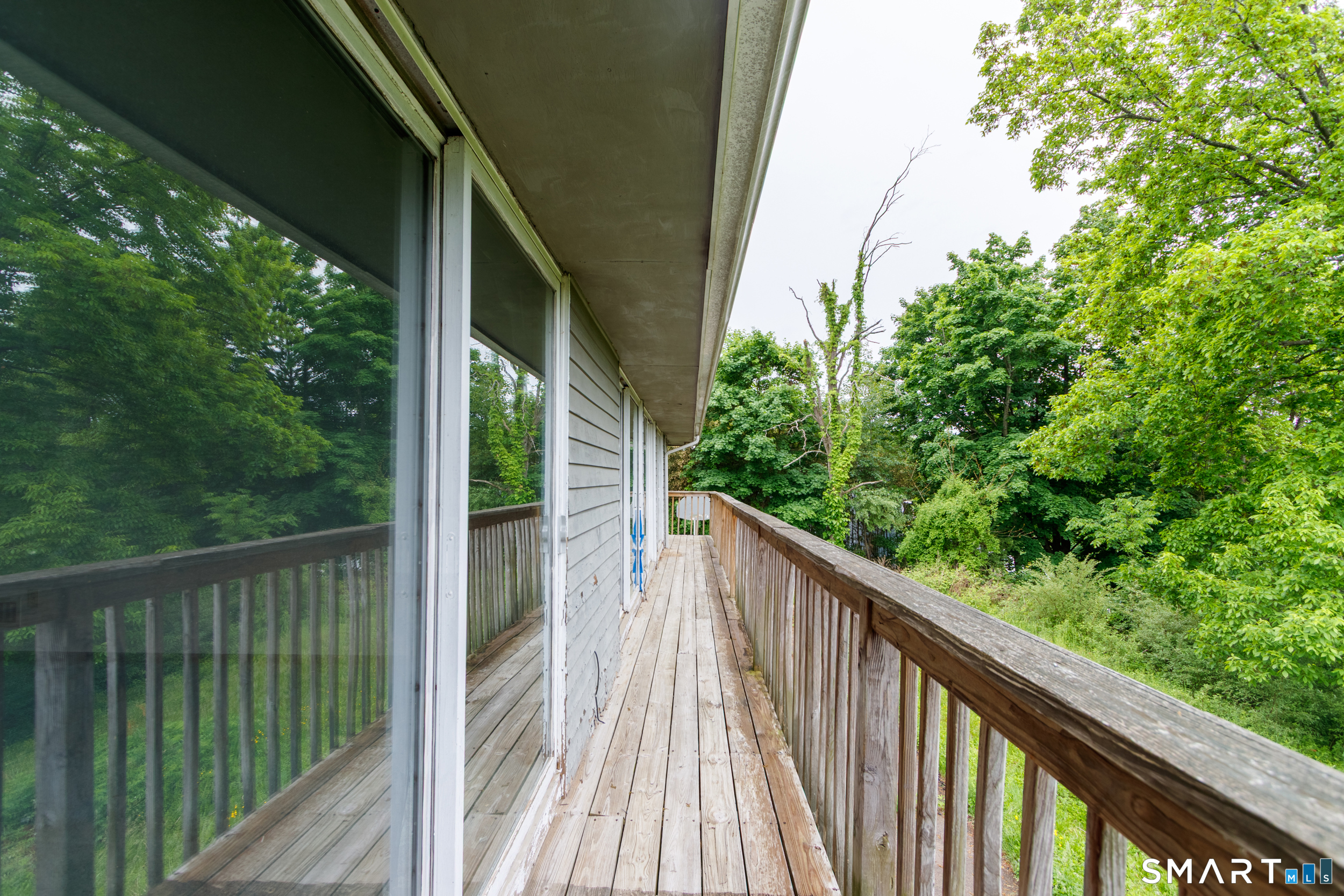 63 High Hill Road Wallingford, CT 06492 - Photo 4 of 34 a view of balcony with wooden floor