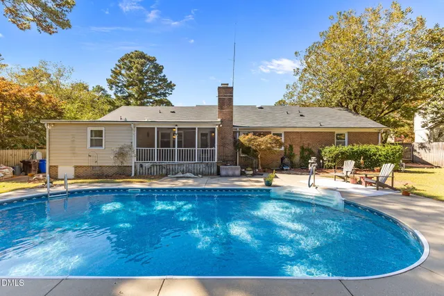 a view of a swimming pool with a patio