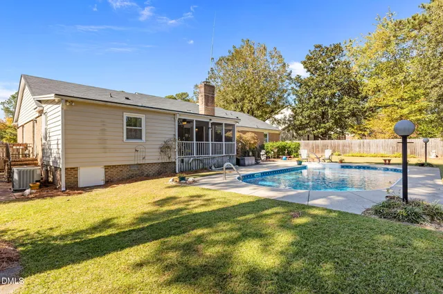a view of a swimming pool and an outdoor space