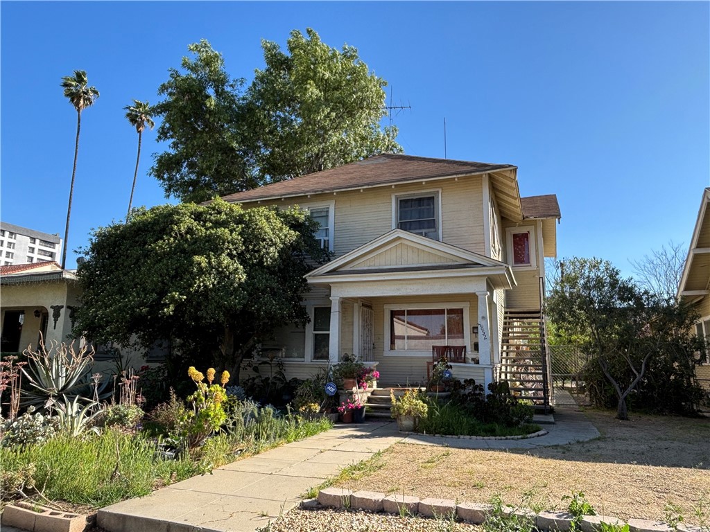 3852 4th Street Riverside, CA 92501 - Photo 1 of 1 a front view of a house with a yard