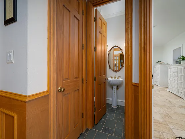 a view of a bathroom with a sink and mirror