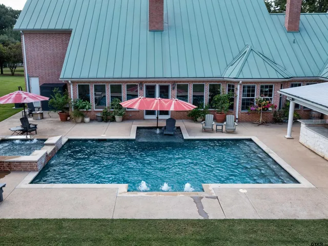 an outdoor sitting area with an umbrella