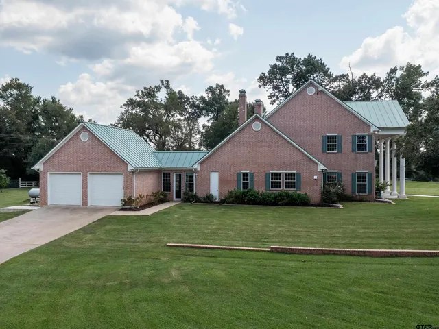 front view of a house and a yard