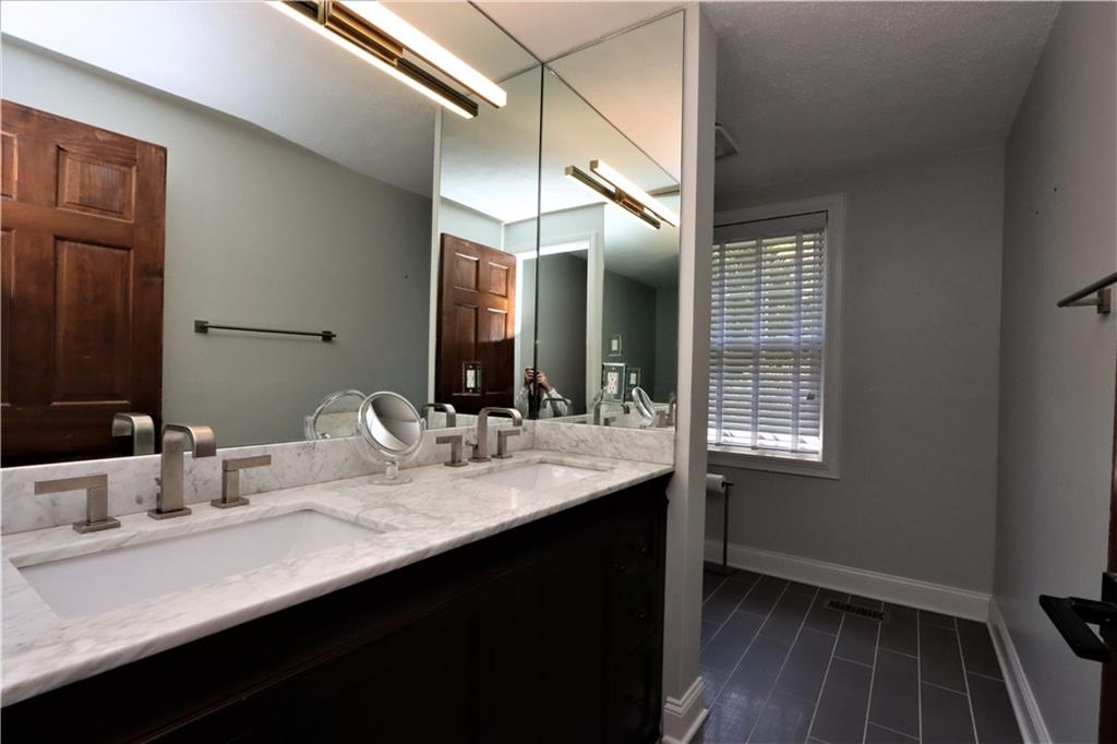 169 Mary Reed Road Baden, PA 15005 - Photo 11 of 24 a bathroom with a sink and a mirror