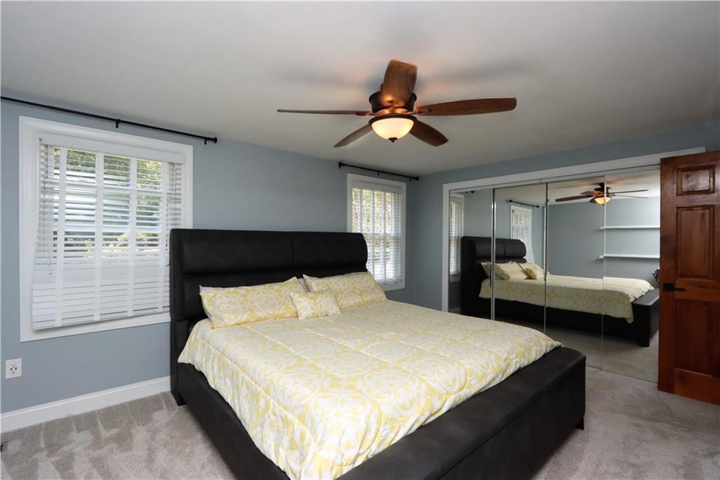 169 Mary Reed Road Baden, PA 15005 - Photo 13 of 24 a bedroom with a bed and wooden floor