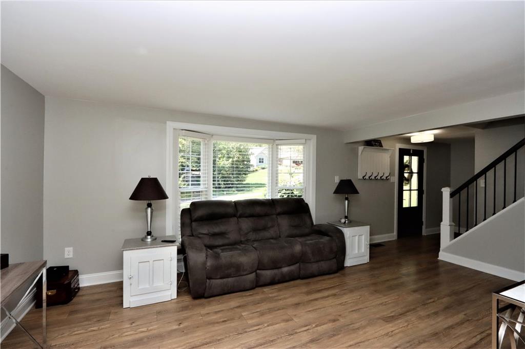 169 Mary Reed Road Baden, PA 15005 - Photo 2 of 24 a living room with furniture and a window