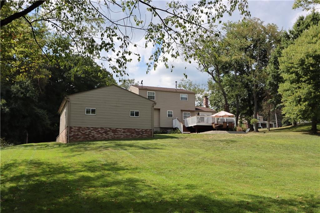 169 Mary Reed Road Baden, PA 15005 - Photo 21 of 24 a view of a couches in front of house with yard