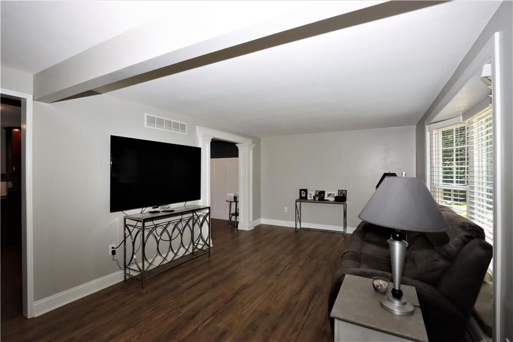 169 Mary Reed Road Baden, PA 15005 - Photo 3 of 24 a living room with furniture and a flat screen tv