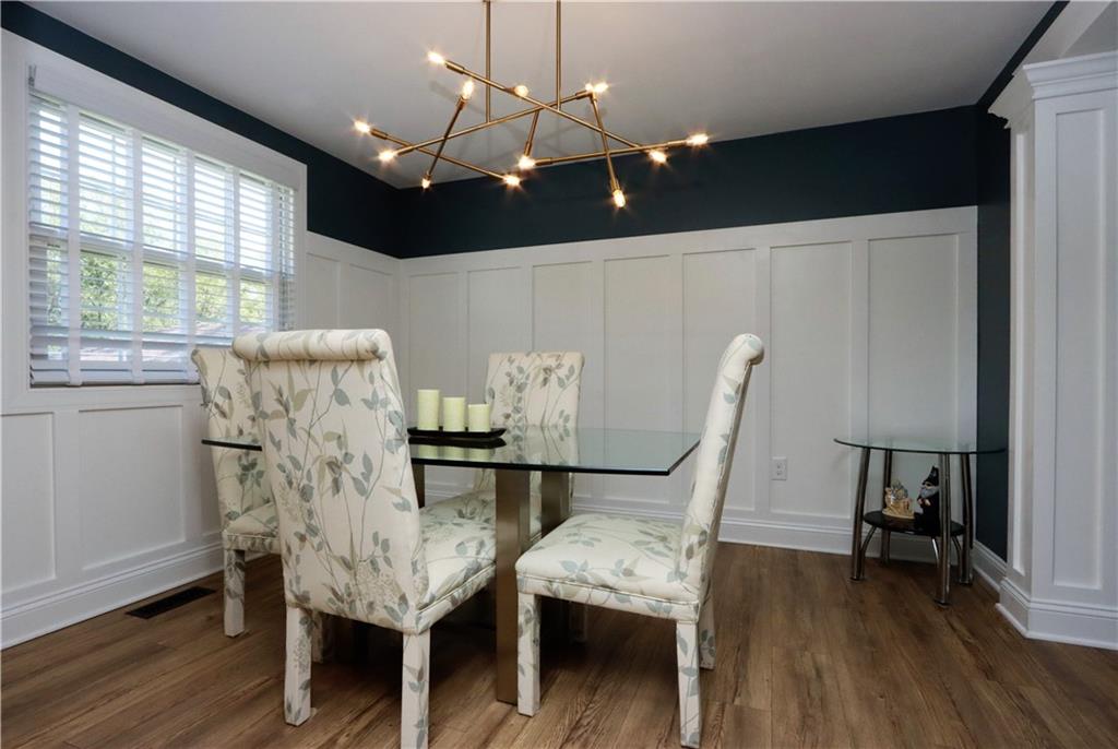 169 Mary Reed Road Baden, PA 15005 - Photo 4 of 24 a view of a dining room with furniture and wooden floor