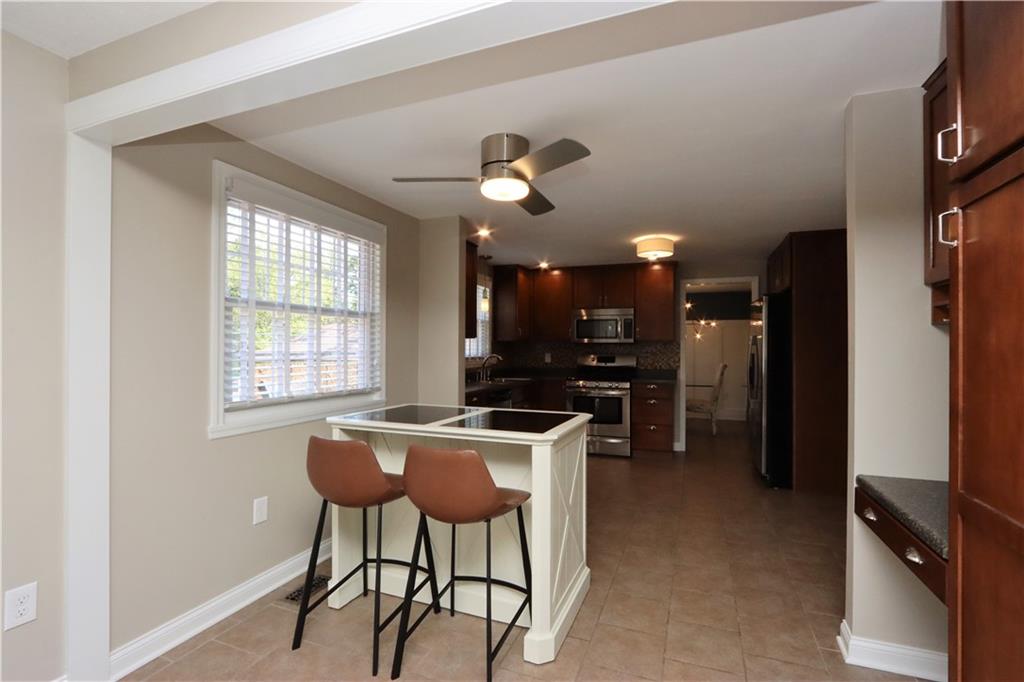 169 Mary Reed Road Baden, PA 15005 - Photo 7 of 24 a view of a dining room with furniture window and wooden floor
