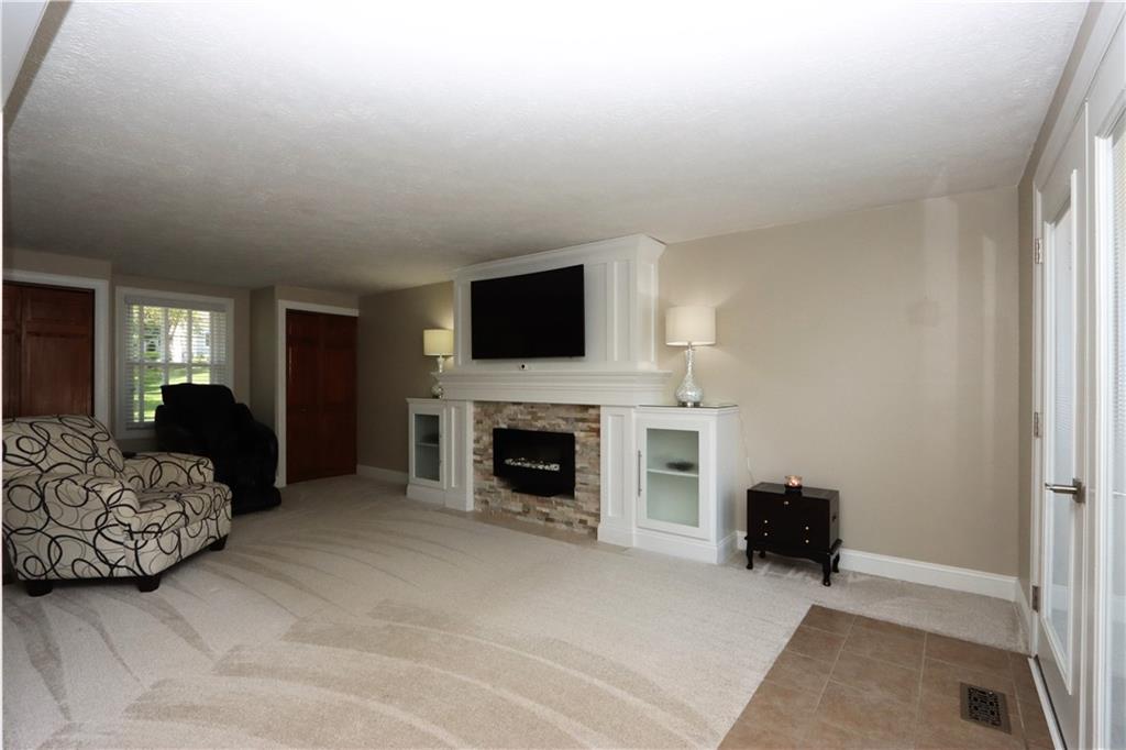 169 Mary Reed Road Baden, PA 15005 - Photo 9 of 24 a bedroom with a bed and a fireplace