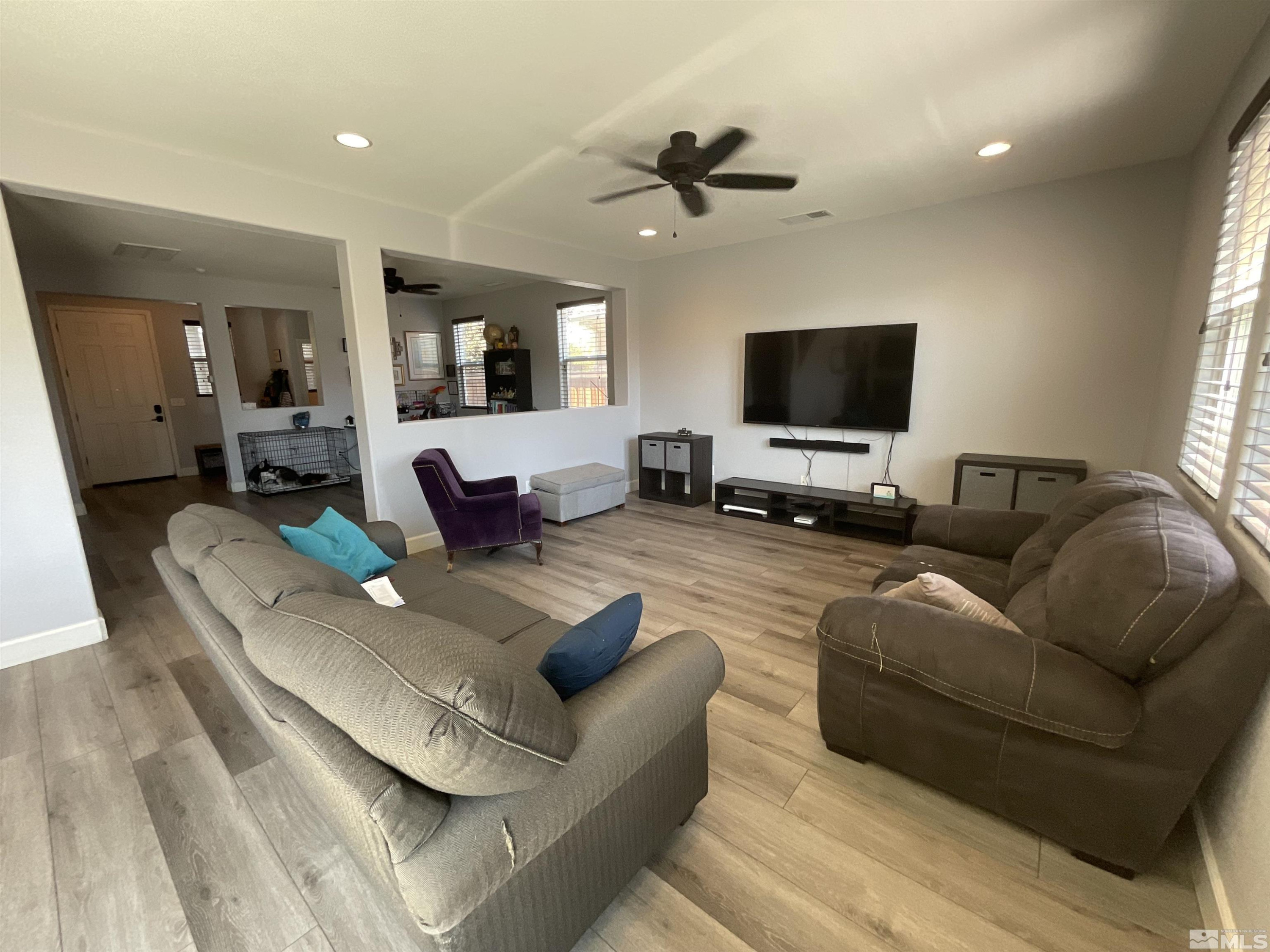 11640 Cervino Drive Reno, NV 89521 - Photo 11 of 26 a living room with furniture and a flat screen tv