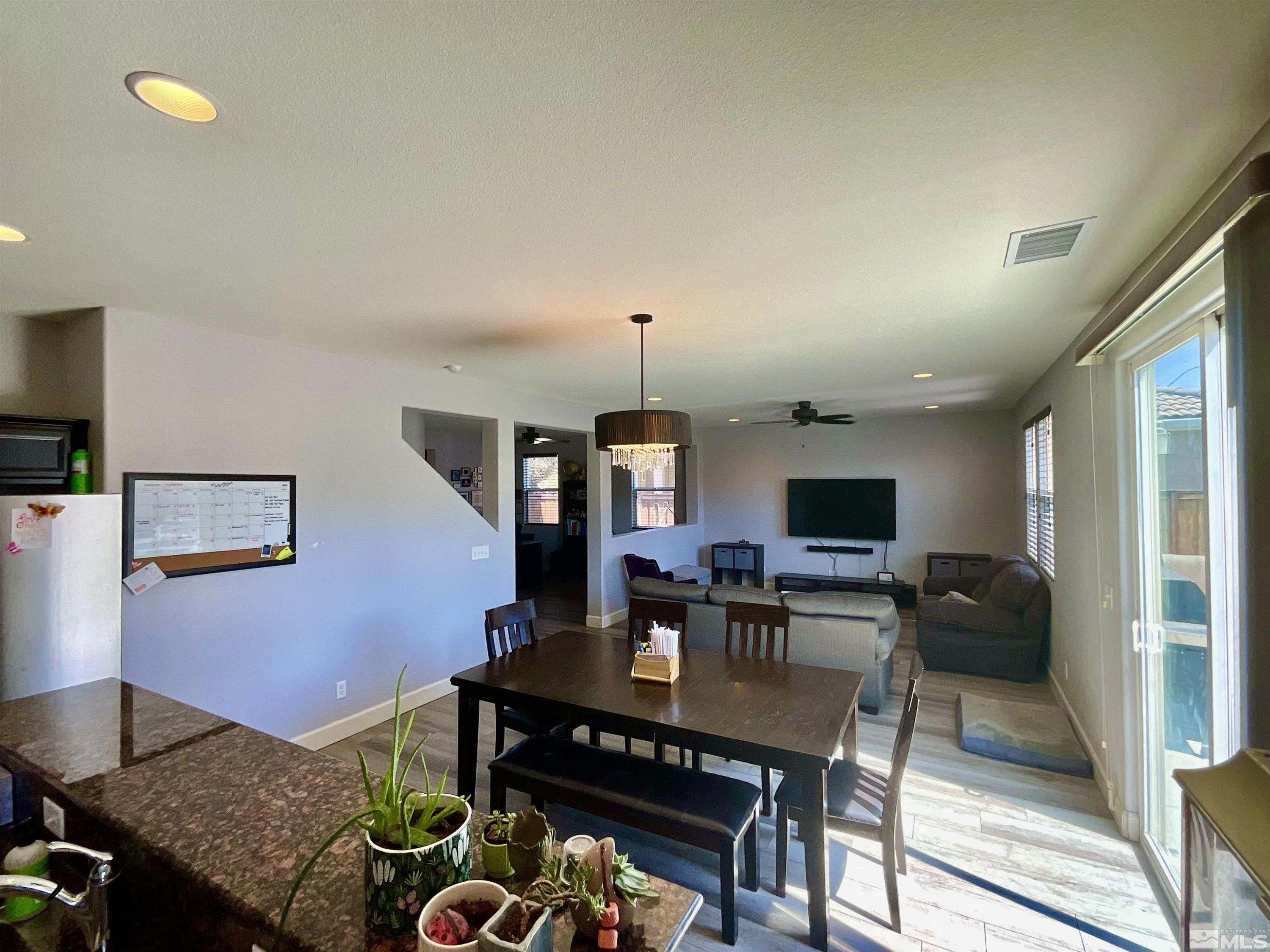 11640 Cervino Drive Reno, NV 89521 - Photo 12 of 26 a living room with furniture a flat screen tv and a table