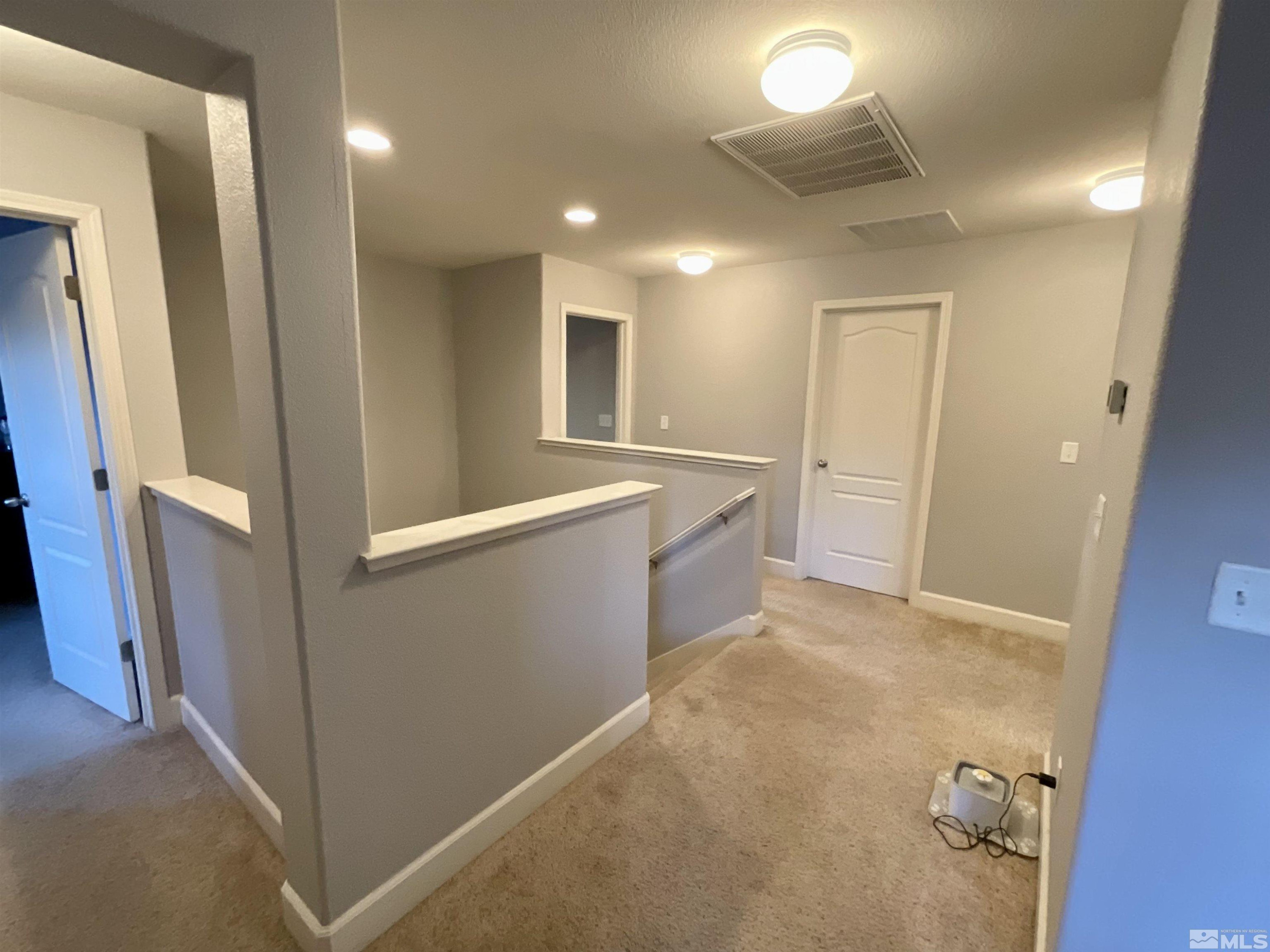 11640 Cervino Drive Reno, NV 89521 - Photo 13 of 26 a view of a hallway to rooms
