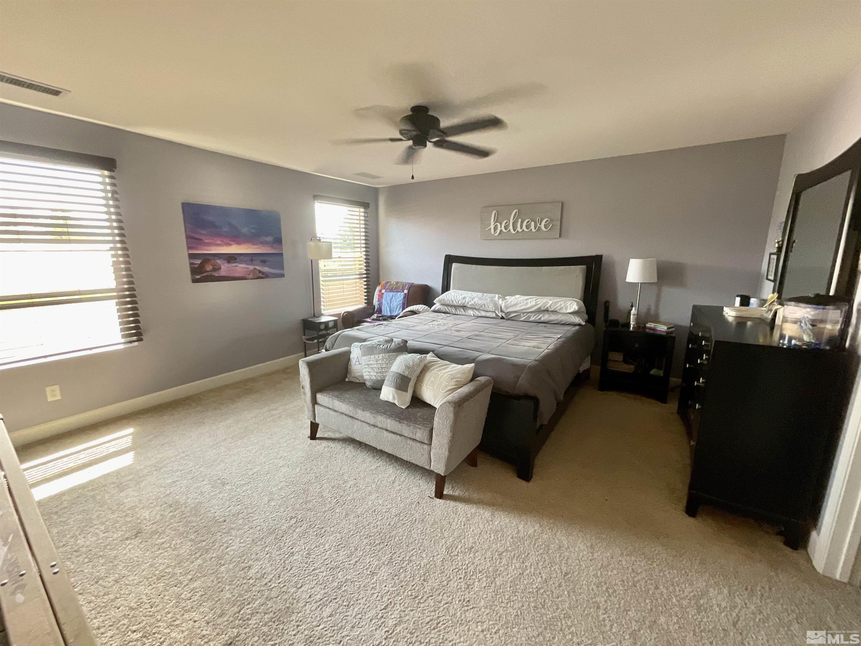 11640 Cervino Drive Reno, NV 89521 - Photo 16 of 26 a bedroom with a bed and a large window