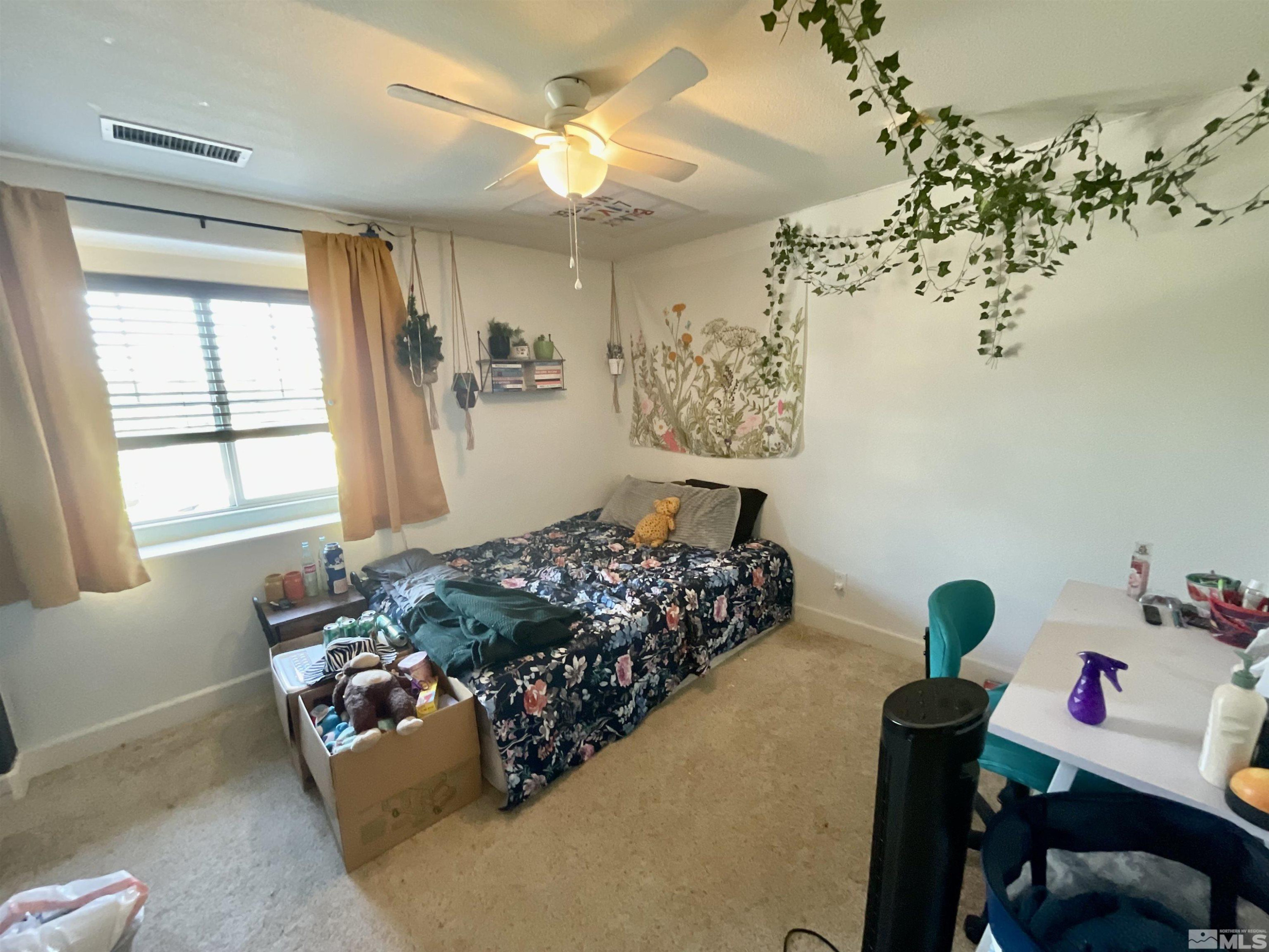 11640 Cervino Drive Reno, NV 89521 - Photo 20 of 26 a bed room with a bed and a window