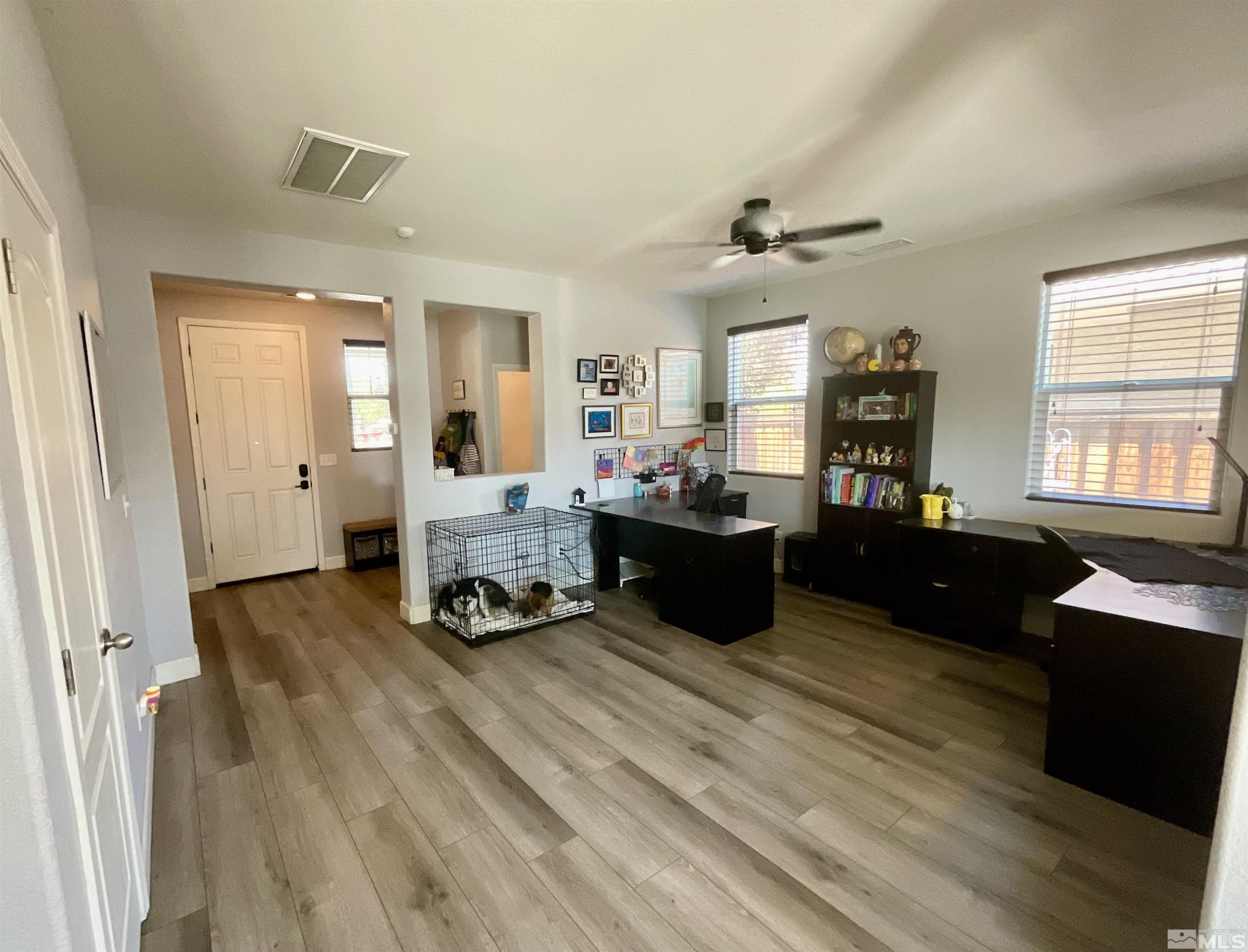 11640 Cervino Drive Reno, NV 89521 - Photo 4 of 26 a living room with furniture and wooden floor