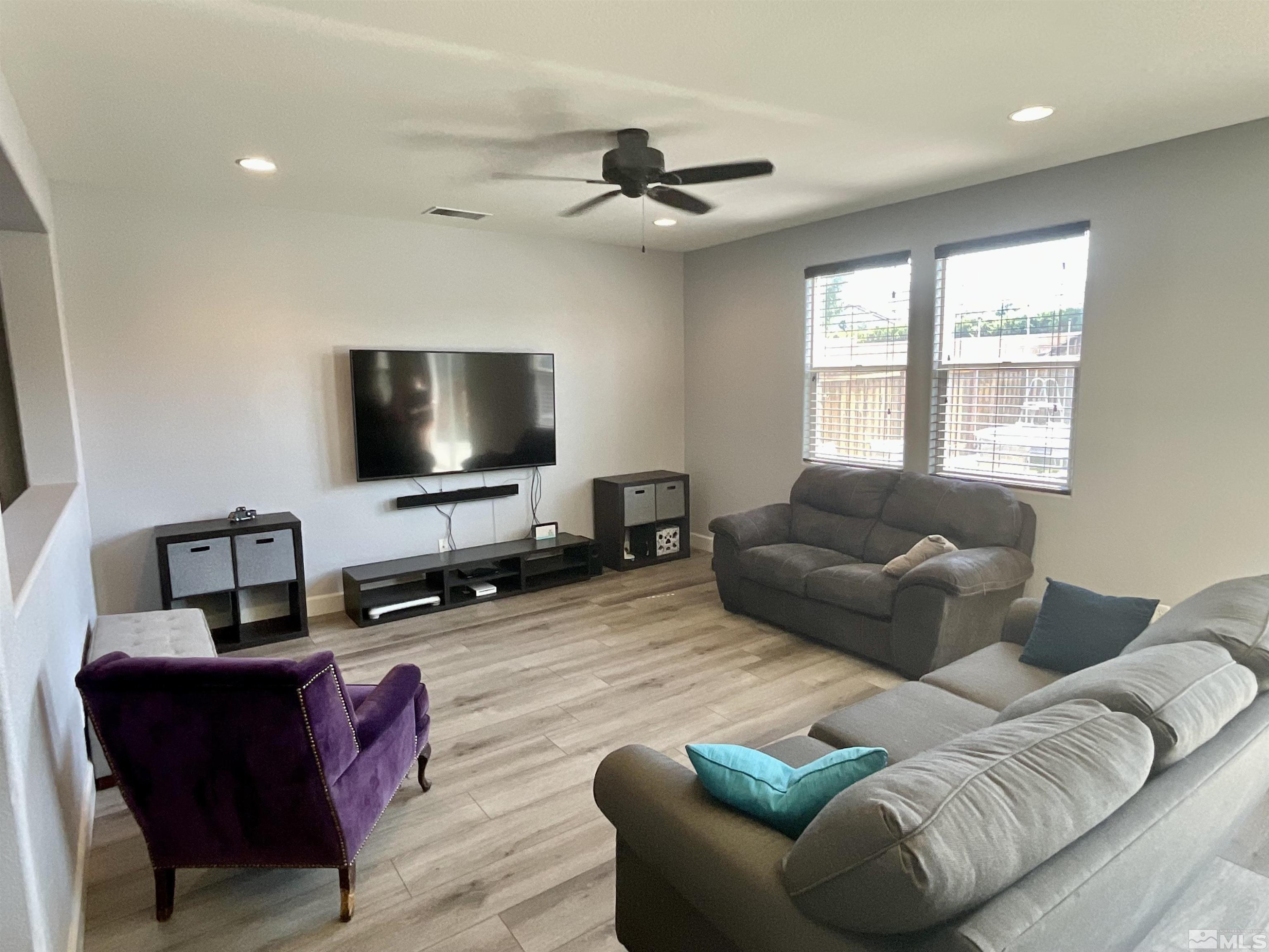 11640 Cervino Drive Reno, NV 89521 - Photo 5 of 26 a living room with furniture and a flat screen tv